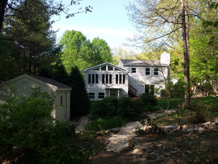 Ons huis van achter in de tuin gezien